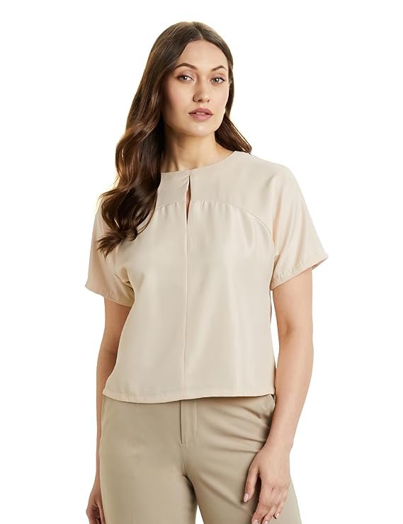 An off-white relaxed fit crop top for women, featuring half sleeves and a round neckline for a desk-to-dinner style.