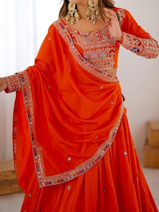 Orange Natural Silk lehenga choli with intricate coding dori embroidery and sequence work for wedding functions and festive occasions.