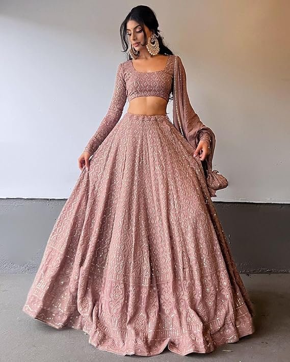 Pink georgette lehenga with sequin embroidery, matching crop top, and long net shrug for wedding party wear