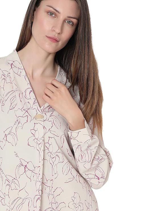 Floral print V-neck women's top with button-up long sleeves and cuff details.