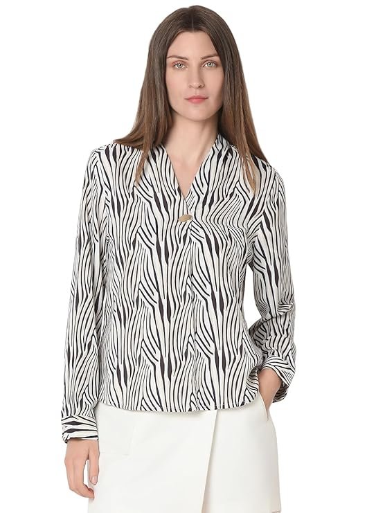 Elegant tan V-neck top for women with button detailing on the long sleeves.