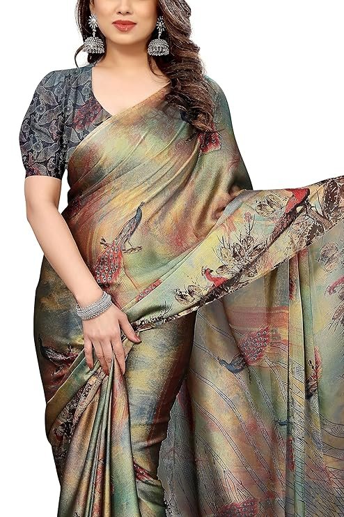 Chiffon saree close-up: intricate forest-style floral and chevron prints in multicolour on lightweight fabric.