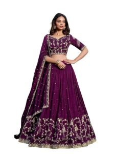 Woman wearing a modern purple party wear lehenga with gold embroidery, styled with dupatta and accessories for festive occasions.