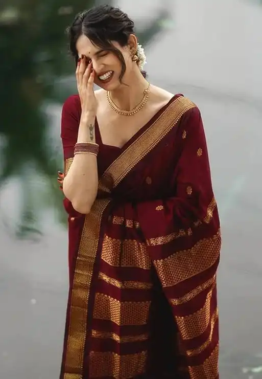 Cherry red silk saree with elegant traditional design for weddings